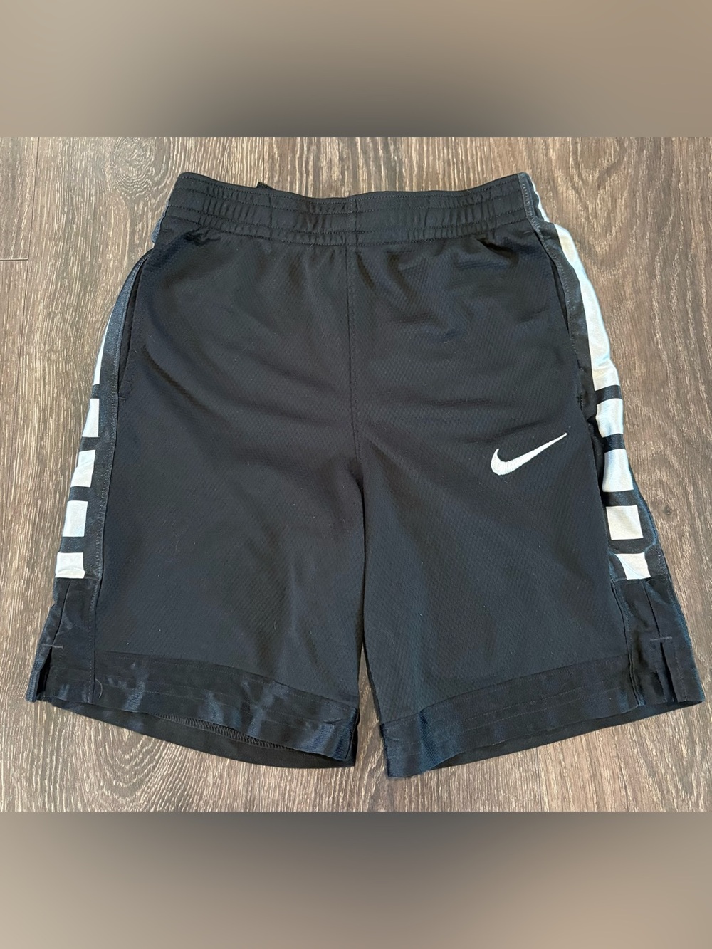 Nike Kids Black Athletic Shorts with White Swoosh